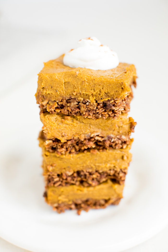 These decadent pumpkin pie bars pair a crunchy granola crust with a creamy, thick pumpkin filling with coconut oil and cashew butter. Vegan & gluten-free.