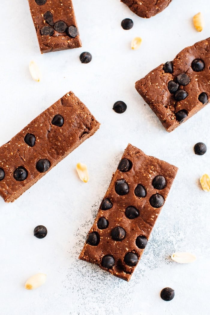 Protein bars with peanuts and chocolate chips sprinkled around