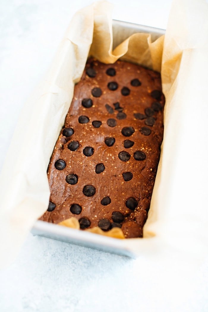 Protein bars in a loaf pan with parchment.