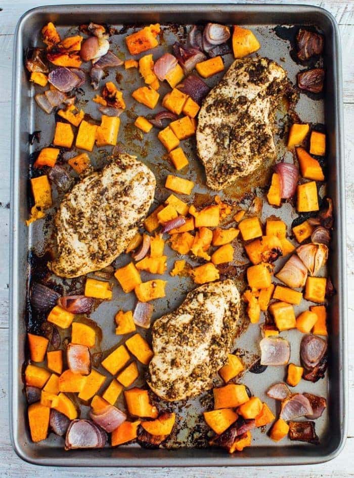 Sheet pan with baked butternut quash, onion, and za'atar chicken.