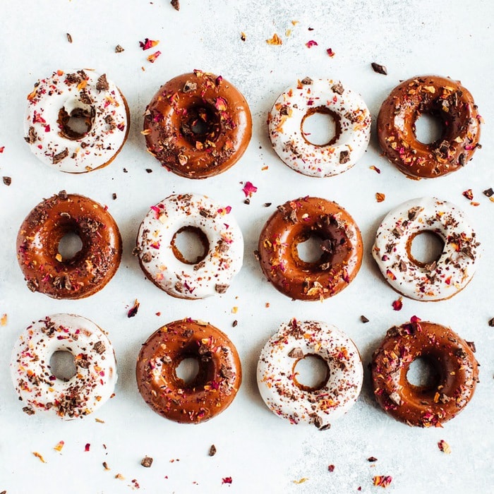 Perfect for Valentine’s Day, these baked almond flour donuts with rose petals and dark chocolate are gluten-free, dairy-free and naturally sweetened with coconut sugar. 