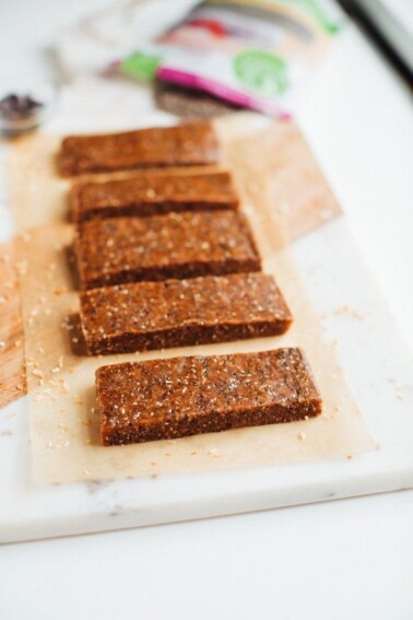 Cutting board with chia bars on it.