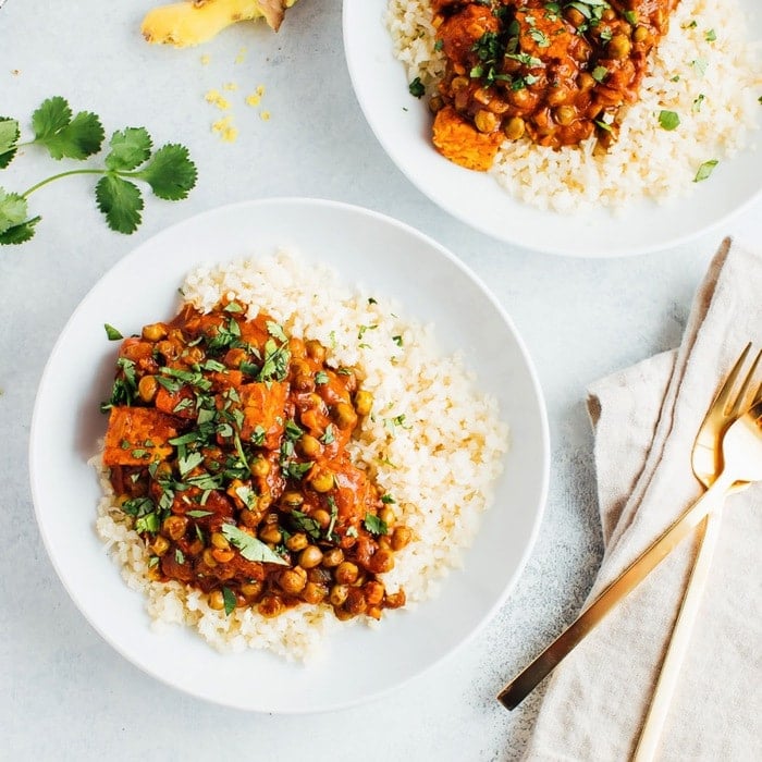 Up Close photo of Vegan Tempeh Tikka Masala with two forks. 