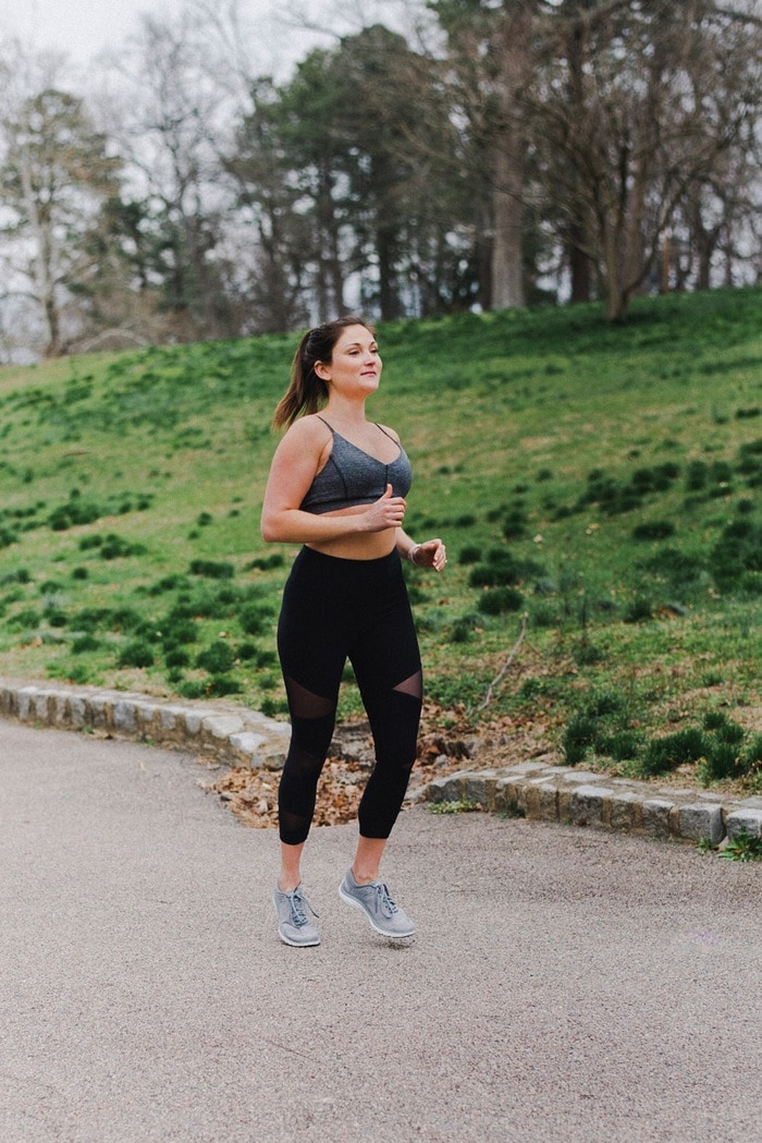 Woman running outside in a park