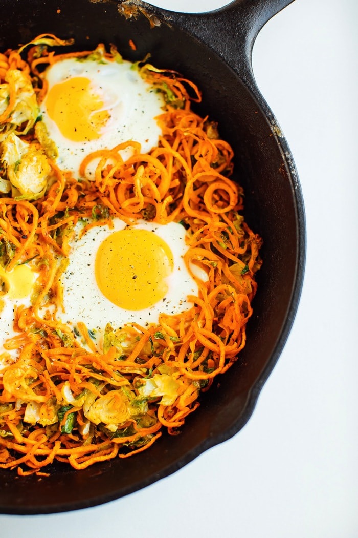 Sweet potato brussels sprout hash in a cast-iron skillet