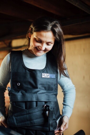 Woman wearing a weighted vest.