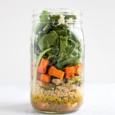 Mason jar with layers of lentil salad.