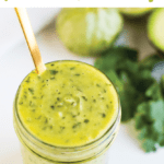 Chopt Mexican Goddess with tomatillos and avocado in a mason jar with a gold spoon.