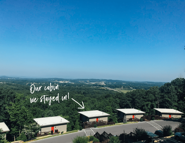 Four cabins with the view of the Blue Ridge Mountains in the background. Text that reads "our cabin we stayed in" with an arrow pointing towards a cabin.