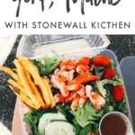 Salad with lobster, tomatoes, cucumbers, dressing, and fries in a plastic container. Text reads "A Visit to York, Maine with Stonewall Kitchen"