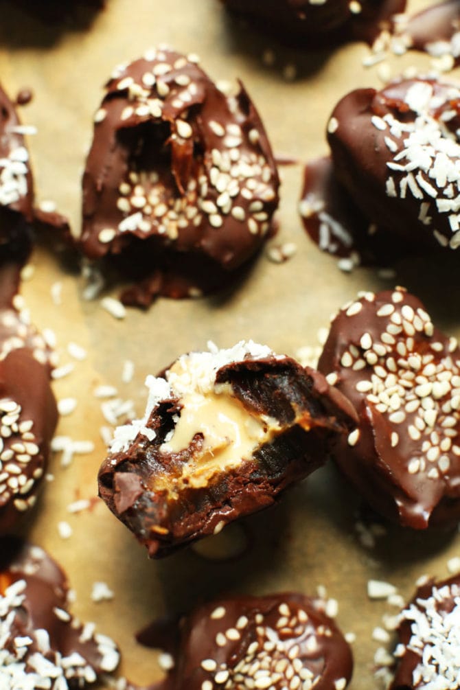Tahini stuffed and chocolate covered dates sprinkled with sesame seeds.