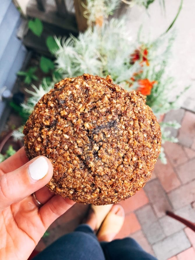 PIN THIS--> A Trip to York, ME and Portland, ME Woman holding a large gluten-are cookie.