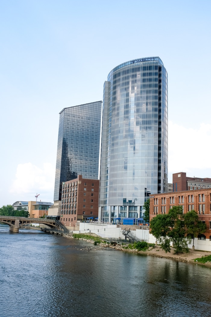 JW Marriott Hotel Grand Rapids Downtown, a tall skyscraper-like building on the river.