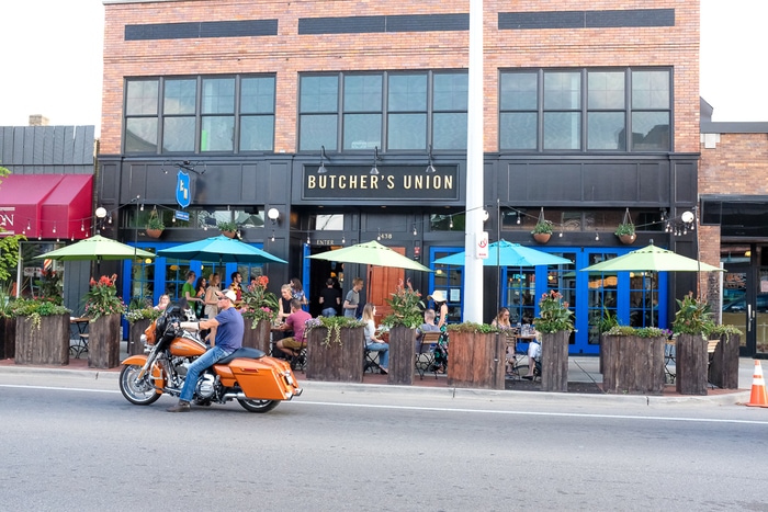 Butcher's Union, a restaurant with an outdoor patio along a city street in Grand Rapids, MI.