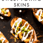 Plant-based sweet potato skins on a baking sheet topped with vegan sour cream.