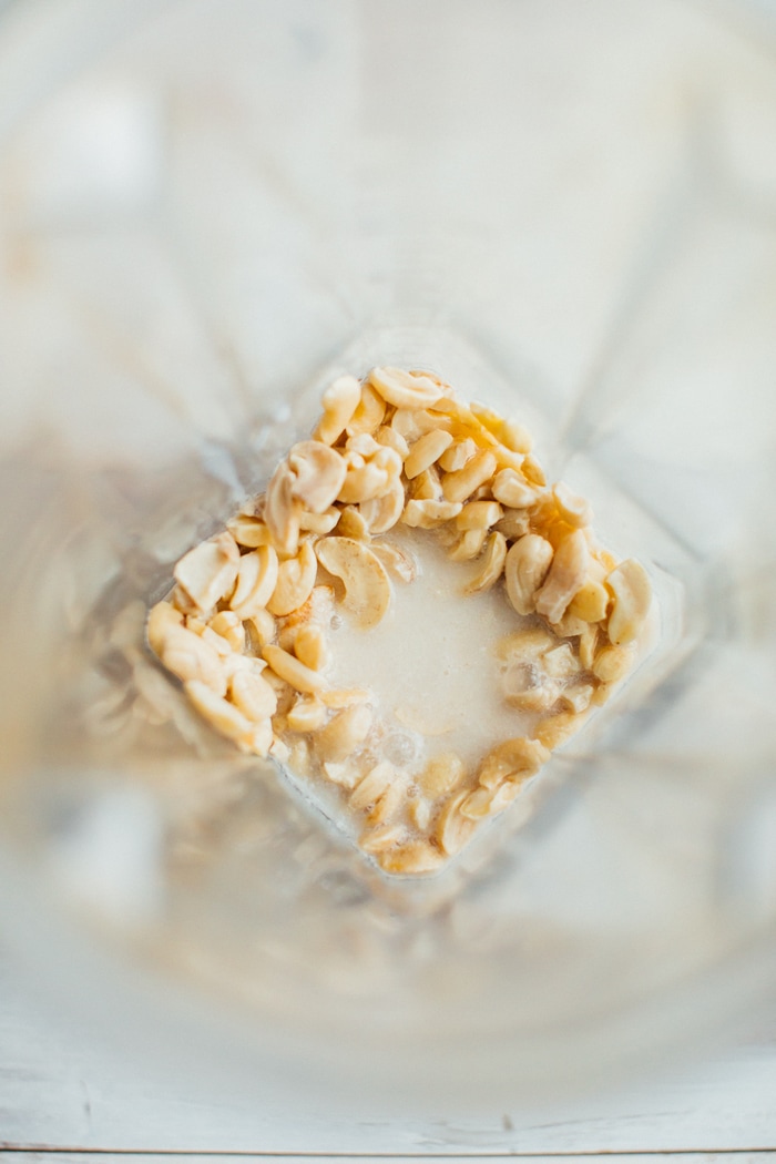 Cashews and non-dairy milk in a Vitamix blender. 