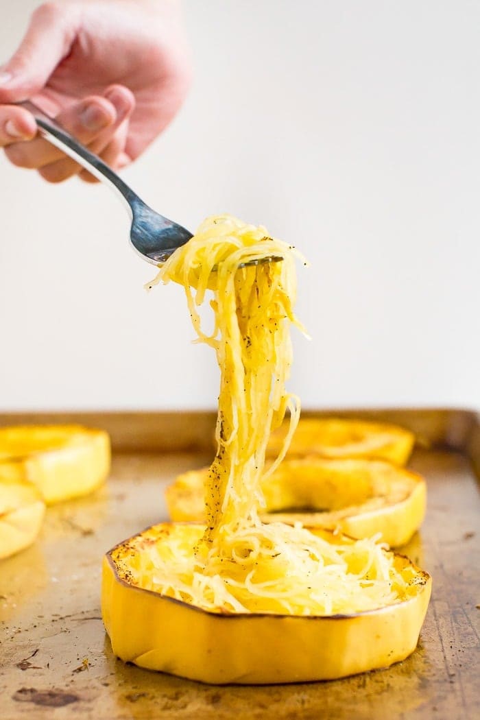Fork twirling a forkful of roasted spaghetti squash.