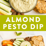 Creamy, low card, high protein Almond Pesto Dip on a snack tray with crackers, almonds, cucumbers and mini peppers.