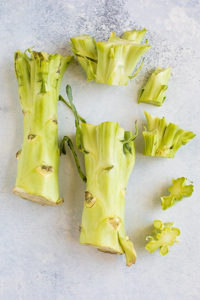 Broccoli stalks chopped on a table without the floret.