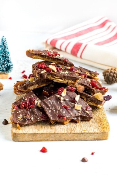 Healthy Christmas Crack made with toffee, almond crackers and topped with chocolate, nuts and cranberries.