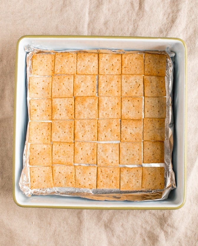 Baking dish lined with almond flour crackers.