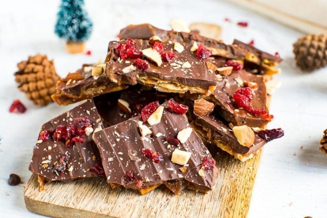 Healthy Christmas Crack made with toffee, almond crackers and topped with chocolate, nuts and cranberries.