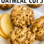 Three apple cinnamon baked oatmeal cups on a plate and drizzled with peanut butter.