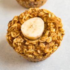 Close up of baked oatmeal cup with banana.