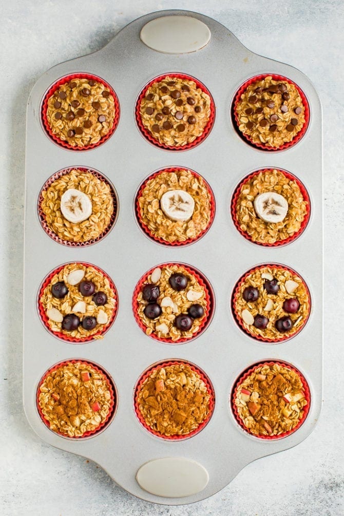 Muffin tin with baked oatmeal cups 4 ways.