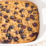 White baking dish with blueberry baked oatmeal.