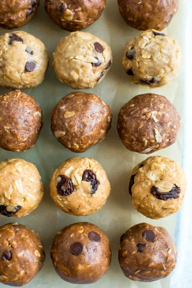 Parchment paper lined with different flavors of protein balls.