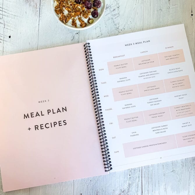 Meal plan spiral bound book, open on a counter.