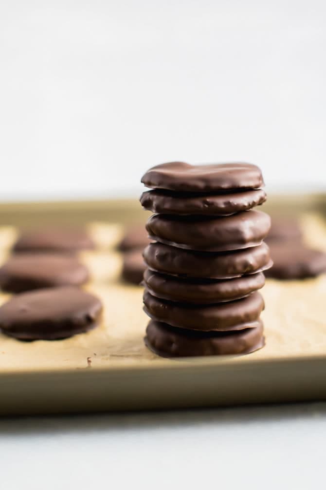 Stack of healthy Thin Mint cookies on a cookie sheet.