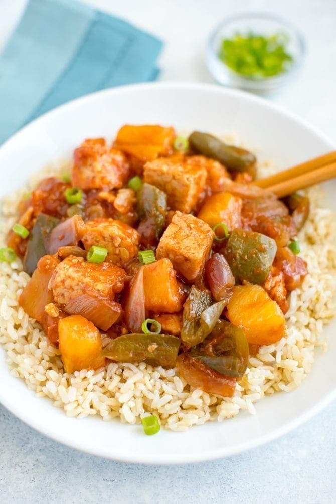 Slow cooker tempeh, onion, pineapple and peppers served over brown rice.