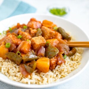 Slow cooker tempeh, onion, pineapple and peppers served over brown rice.