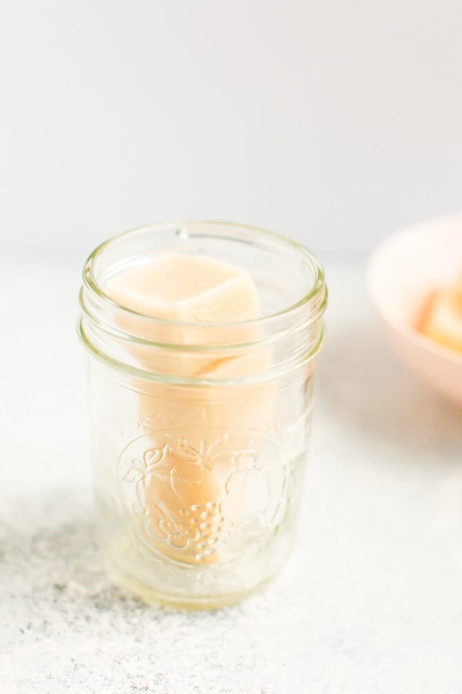 Mason jar with Almond Breeze almondmilk creamer ice cubes.