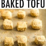 Crispy baked tofu on a sheet pan with parchment paper.