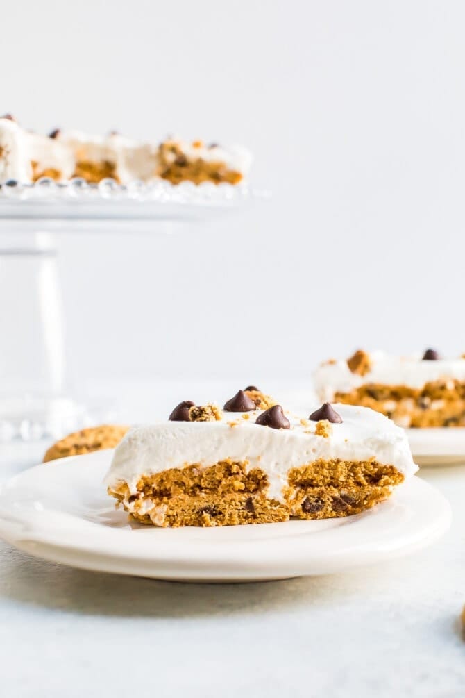 Slice of chocolate chip cookie ice box cake on a plate.