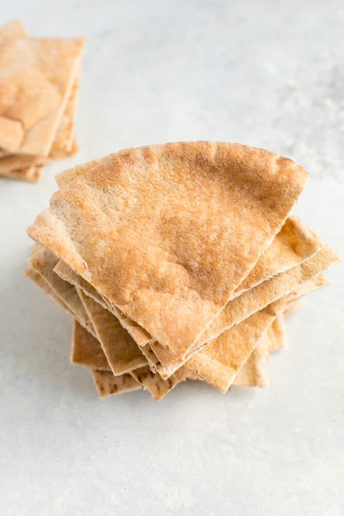 Sliced and quartered pita bread in a stack.