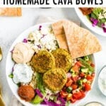 Falafel bowl with baked falafel, hummus, feta, pita, salad and rice.