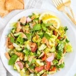 Fattoush salad with lettuce, herbs, vegetables and pita chips/