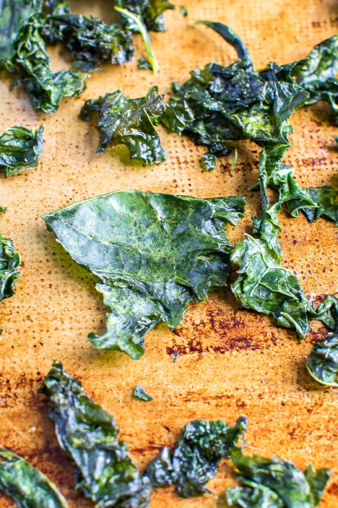 kale chips caked on a baking sheet.