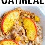 Bowl of peach baked oatmeal topped with almond milk and cinnamon,