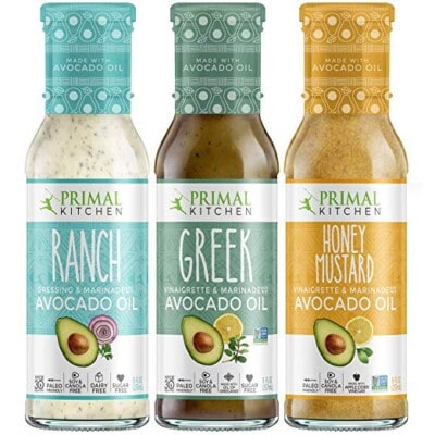 Primal kitchen ranch, greek, and honey mustard marinades in bottles.