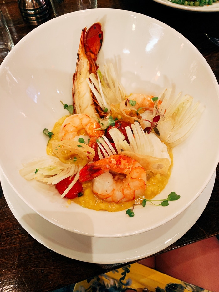 Dinner plate with lobster and shrimp.