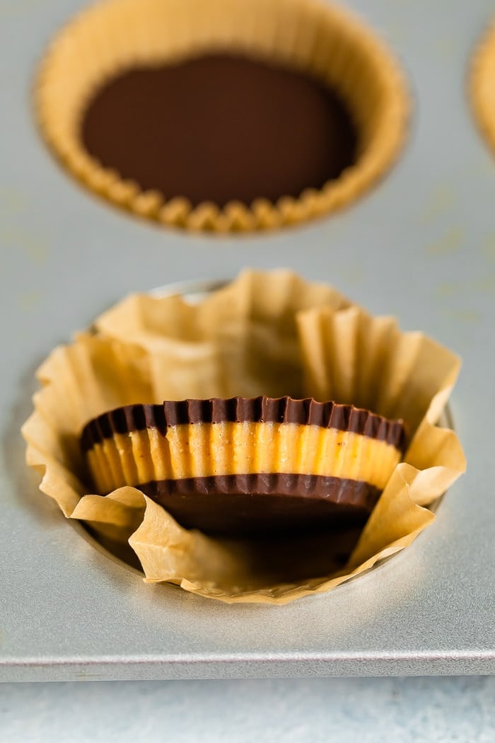 Homemade peanut butter cup taken out of its muffin paper liner.