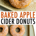 Baked apple cider donuts on a sheet with a glass of cider.