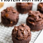 Double chocolate protein muffins on a cooling rack.