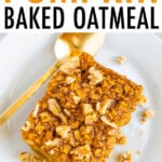 Slice of pumpkin baked oatmeal topped with walnuts and maple syrup. Oatmeal is on a plate with a gold spoon.
