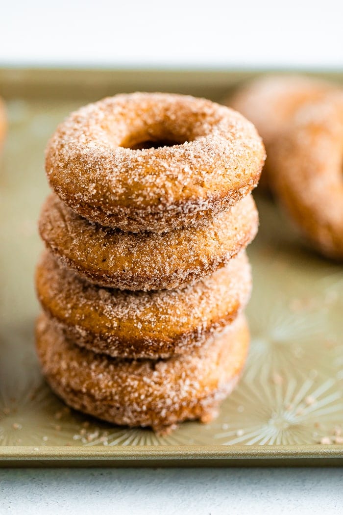 Stack of baked apple cider donuts.